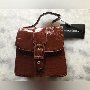 PrettyLittleThing Women's Choc Patent Croc Front Buckle Mini Bag